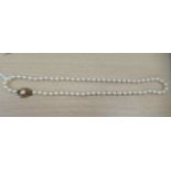 A cultured pearl necklace with a 9ct gold clasp