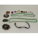 Items of personal ornament: to include two green jade graduated bead necklaces; and an oval micro-