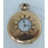 A Dennison 9ct gold cased half-hunter pocket watch, the keyless 15 jewel movement faced by a white