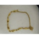 A Chinese 22ct gold oval bar link bracelet