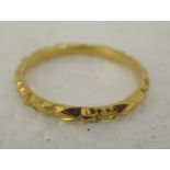 A Chinese 22ct gold band design ring