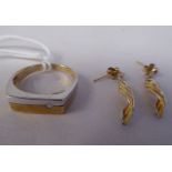 A 9ct white and yellow gold ring; and a pair of 9ct gold leaf design earrings
