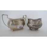 19thC silver teaware, viz. an embossed oval sugar basin; and a panelled example with twin handles,
