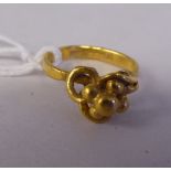 A Chinese high grade gold knot design ring