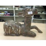 A vintage carved wooden papier mache mould, fashioned as a seated deer  12"h
