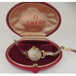 A ladies Omega 9ct gold cased bracelet wristwatch, faced by a gilded Arabic dial, on a flexible