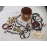 Costume jewellery: to include a silver hinged bangle; and assorted beads