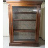 A 1930s oak pier cabinet, enclosing three shelves, on a plinth  42"h  30"w