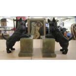 A pair of cast iron bookends 'Scottish Terriers' on onyx plinths  5.5"h overall