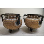 A pair of early 20thC Royal Doulton Lambeth stoneware three handled vases of squat, bulbous form