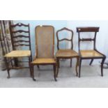Four 19thC and later chairs: to include a Regency crossbanded mahogany bar back example with a woven