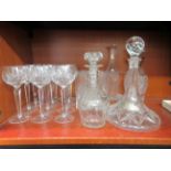 Domestic glassware: to include a cut crystal ships decanter with a silver label, on a chain