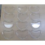 A set of twelve Val St. Lambert glass crescent shaped entrée dishes