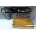 A mixed lot: to include Edwardian brass postal scales and weights; and an olivewood games box, in