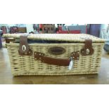 A Sherwood Hampers woven cane picnic basket  comprising four place settings and a woven wool