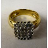 A 9ct gold square, claw set diamond cluster ring