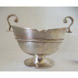 A late Victorian silver pedestal sugar basin with opposing handles  indistinct London marks