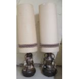 A pair of (possibly) West German two tone streaky glazed pottery floor standing lamps with