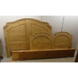 A modern carved pine bed frame, the headboard 66"w