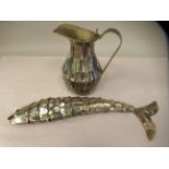 A pava shell flexible fish ornament  15"h; and a similarly decorated brass jug  8"h