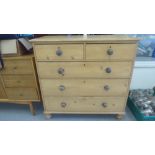 An early 20thC pine five drawer dressing chest, raised on turned legs  40"h  42"w