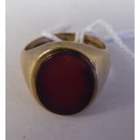 A 9ct gold signet ring, set with a red stone