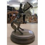 A silvered and black painted, cast bronze figure, a Napoleonic horseman, on a stand  9"h