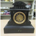 A late Victorian black slate cased mantel clock; the movement faced by a Roman dial  13"h