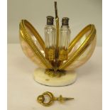 A gilt metal and shell mounted perfume carrier, opening to reveal a pair of cut glass bottles, on an
