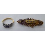 A late Victorian 15ct gold bar brooch; and an 18ct gold and platinum ring, set with a sapphire and