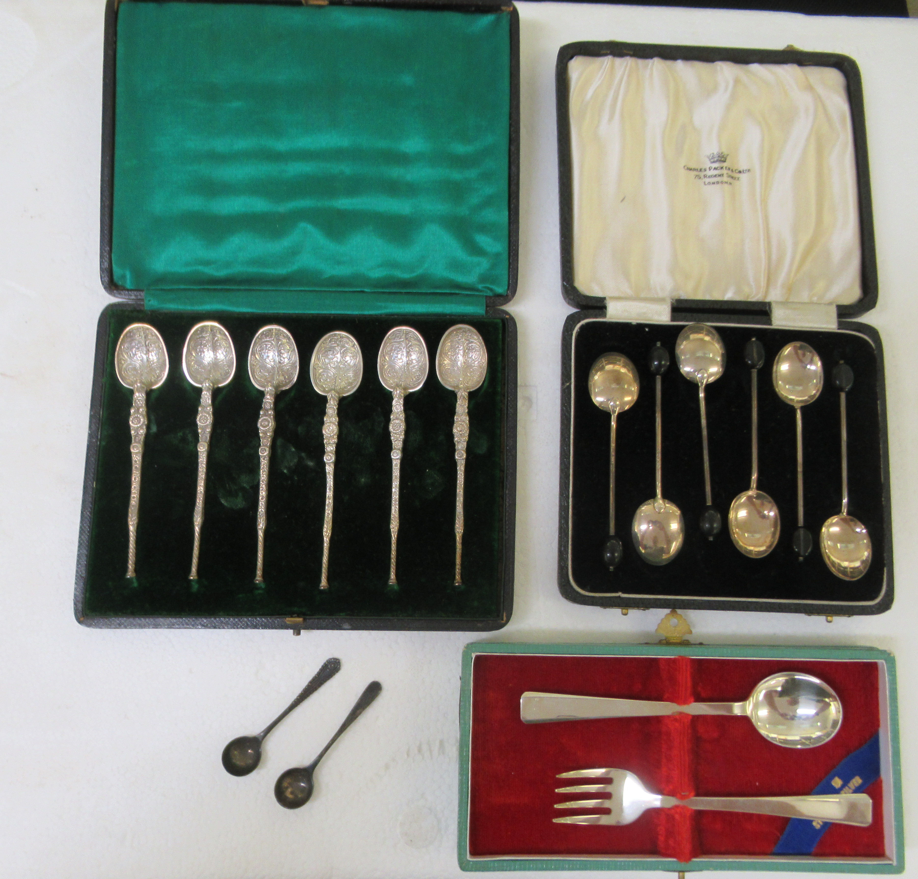 A set of six silver miniature reproduction of early anointing spoons  cased; a set of six silver