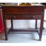 A Victorian and late mahogany clerks desks with an angled scriber, over thee hinged box top and a