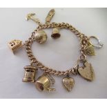 A 9ct gold bracelet with attendant charms