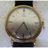 A (probably) 9ct gold cased Omega wristwatch, faced by a baton dial, on a black hide strap