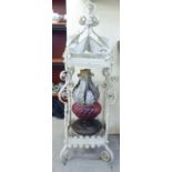 A Victorian painted wrought iron framed pendant lantern of square form, incorporating an oil lamp