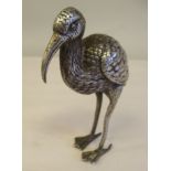 A silver coloured metal model, a wading bird  variously marked  4"h
