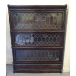 An early 20thC stained oak three section, glazed Globe Wernicke Co bookcase, on a plinth  45"h  34"w