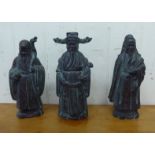 Three similar Chinese patinated bronze standing figures  9"h