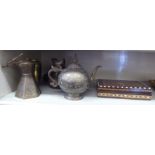 Oriental metalware: to include a decoratively engraved coffee pot with an angled handle