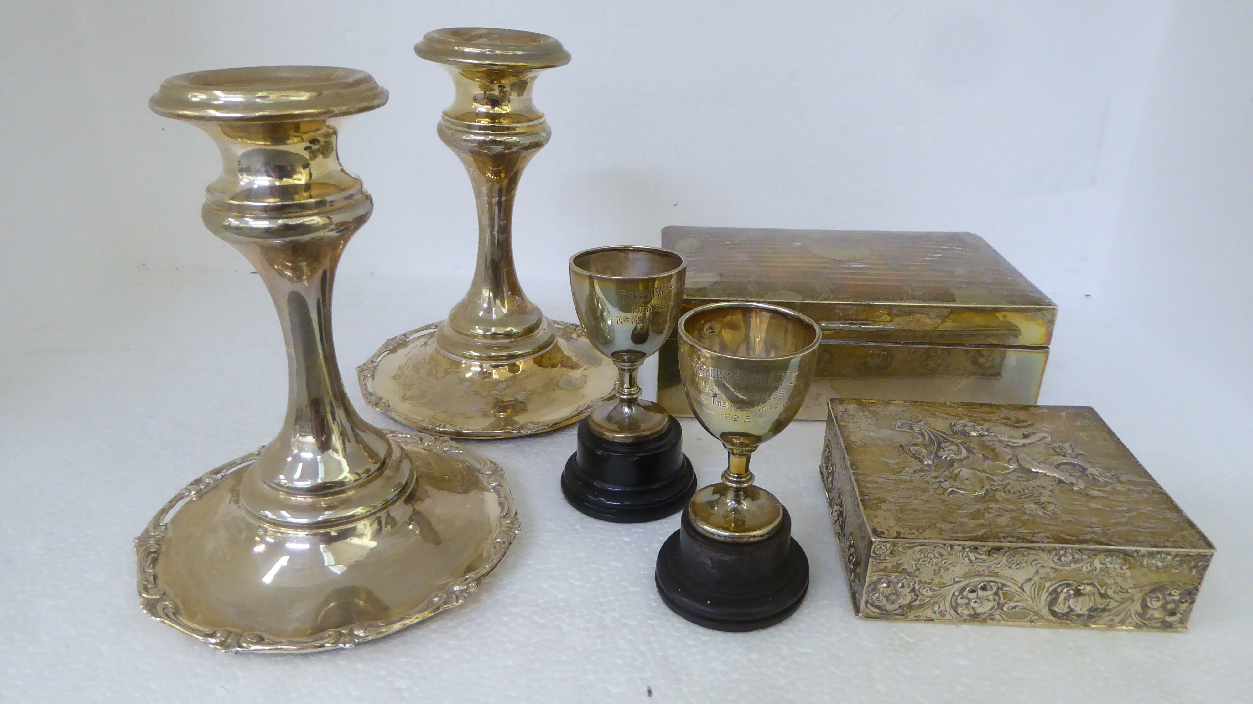 Silver and white metal collectables: to include a pair of candlesticks  5"h; a cigarette box; and