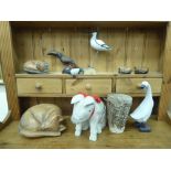 A mixed lot: to include a carved wooden model, a seated pig  8"h