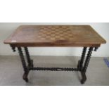 A late Victorian mahogany hall table with an inlaid chequerboard top, over opposing bobbin turned