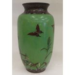 An early 20thC Chinese cloisonné vase, decorated with game birds, on a green ground  12.5"h