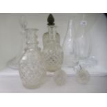 Assorted glass flasks and decanters with stoppers