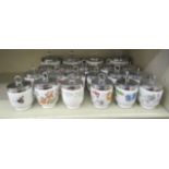 Over twenty Royal Worcester and similar egg coddlers with assorted decoration