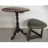 A modern Victorian mahogany pedestal table, over a turned column, raised on a carved, cabriole