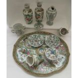 19thC Chinese porcelain: to include a chocolate cup, cover and saucer, decorated with figures in a