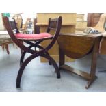 A mid 20thC mahogany folding dressing table chair with railed sides and an upholstered seat,