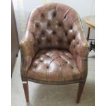 An early 19thC style tub design study chair with a studded and buttoned, mid brown hide back and