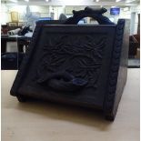 A late Victorian carved Black Forest inspired coal scuttle  14"h  14"w